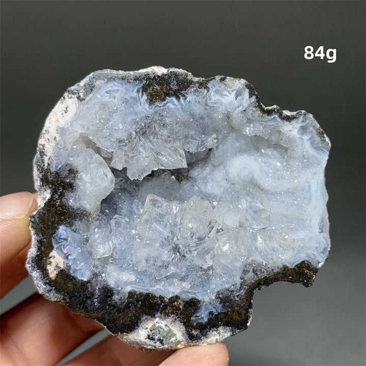 Natural Agate crystal cave egg with sparkling white druzy interior, grounding and healing.
