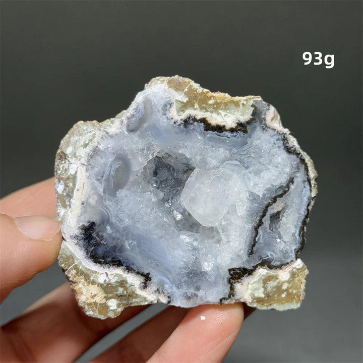Natural Agate crystal cave geode, 93g, with a sparkling white druzy interior and banded rust, cream, gray exterior.