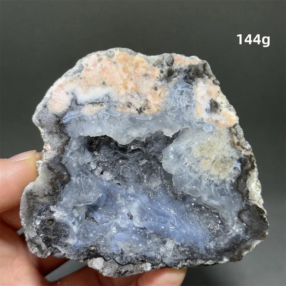 Natural Agate geode slice with a sparkling blue druzy crystal cave interior, grounding and healing.