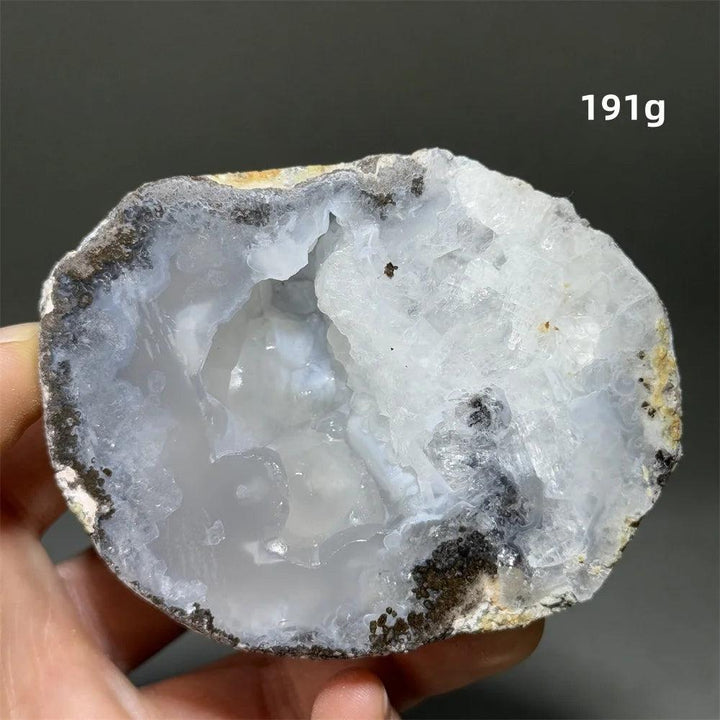 Natural Agate crystal cave egg with a sparkling white druzy interior, grounding and calming.