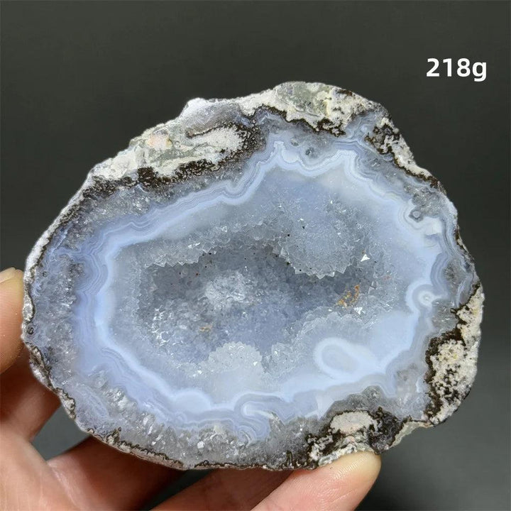 Natural Agate crystal cave egg with a sparkling blue druzy interior, banded exterior, 218g. Grounding and healing.