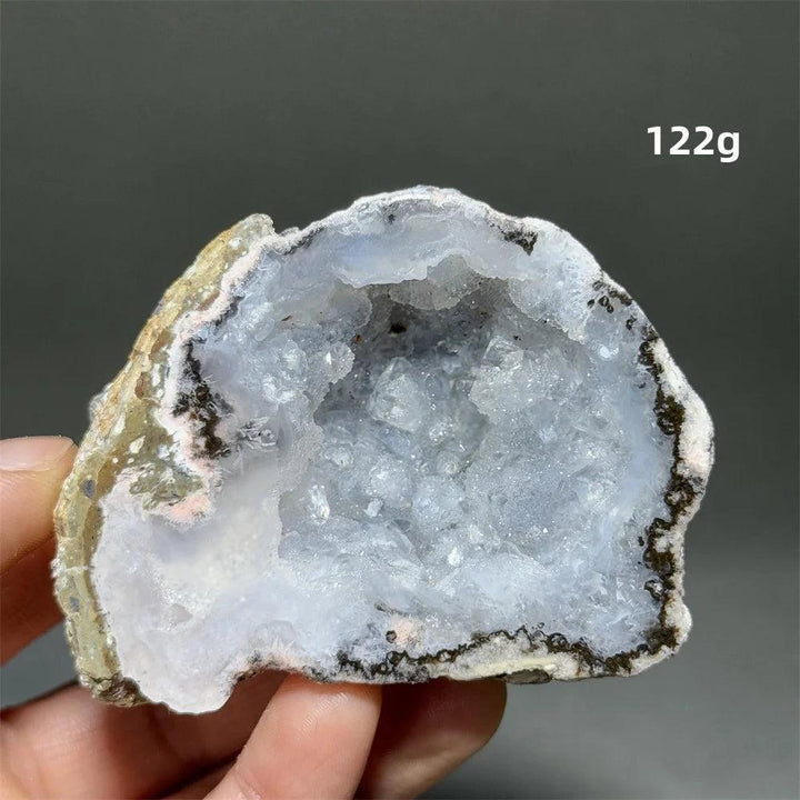Natural Agate crystal cave egg with a sparkling, light blue druzy interior, grounding and healing.