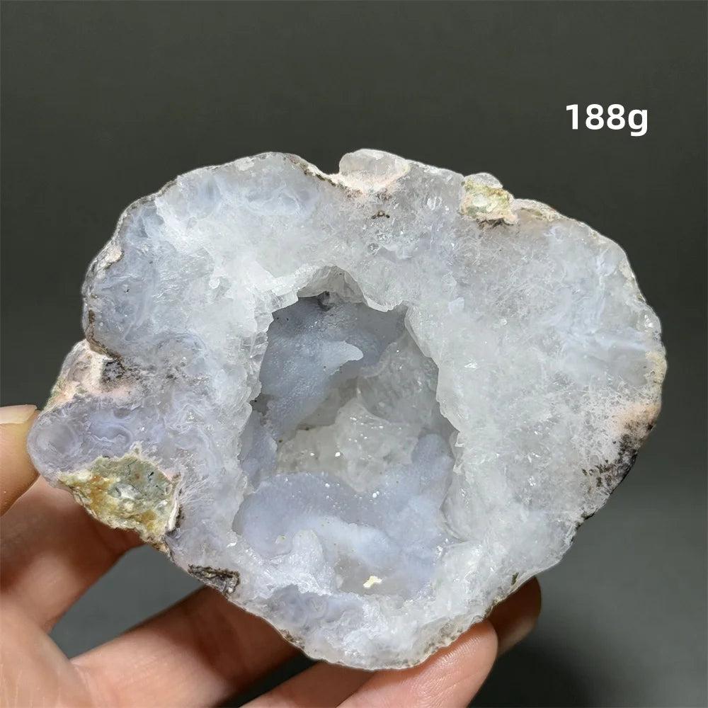 Natural Agate geode cave egg, 188g, with a sparkling white and light blue druzy crystal interior.