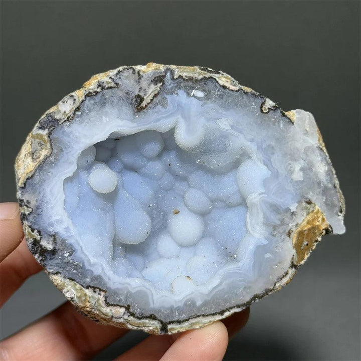 Natural Agate crystal cave egg with a sparkling light blue druzy interior, grounding and healing.