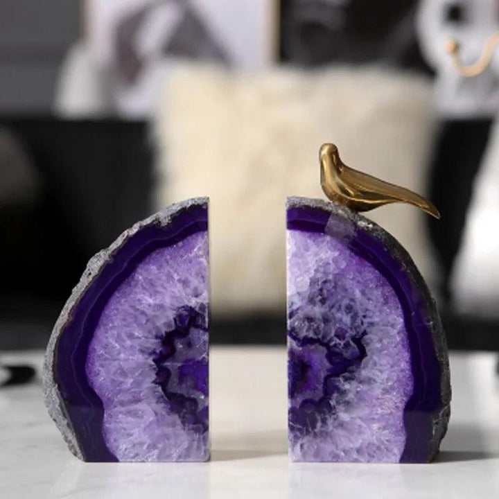 Polished purple agate crystal bookends with natural banding, abstract shape, and a golden bird accent for grounding and stability.