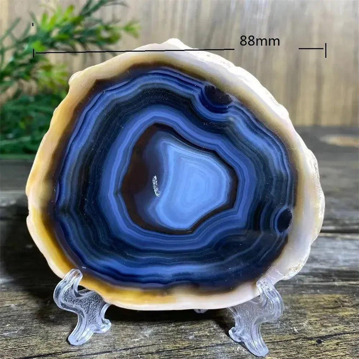 Stunning 88mm Agate Slice with Stand, showcasing intricate blue, black, and white bands for grounding energy.