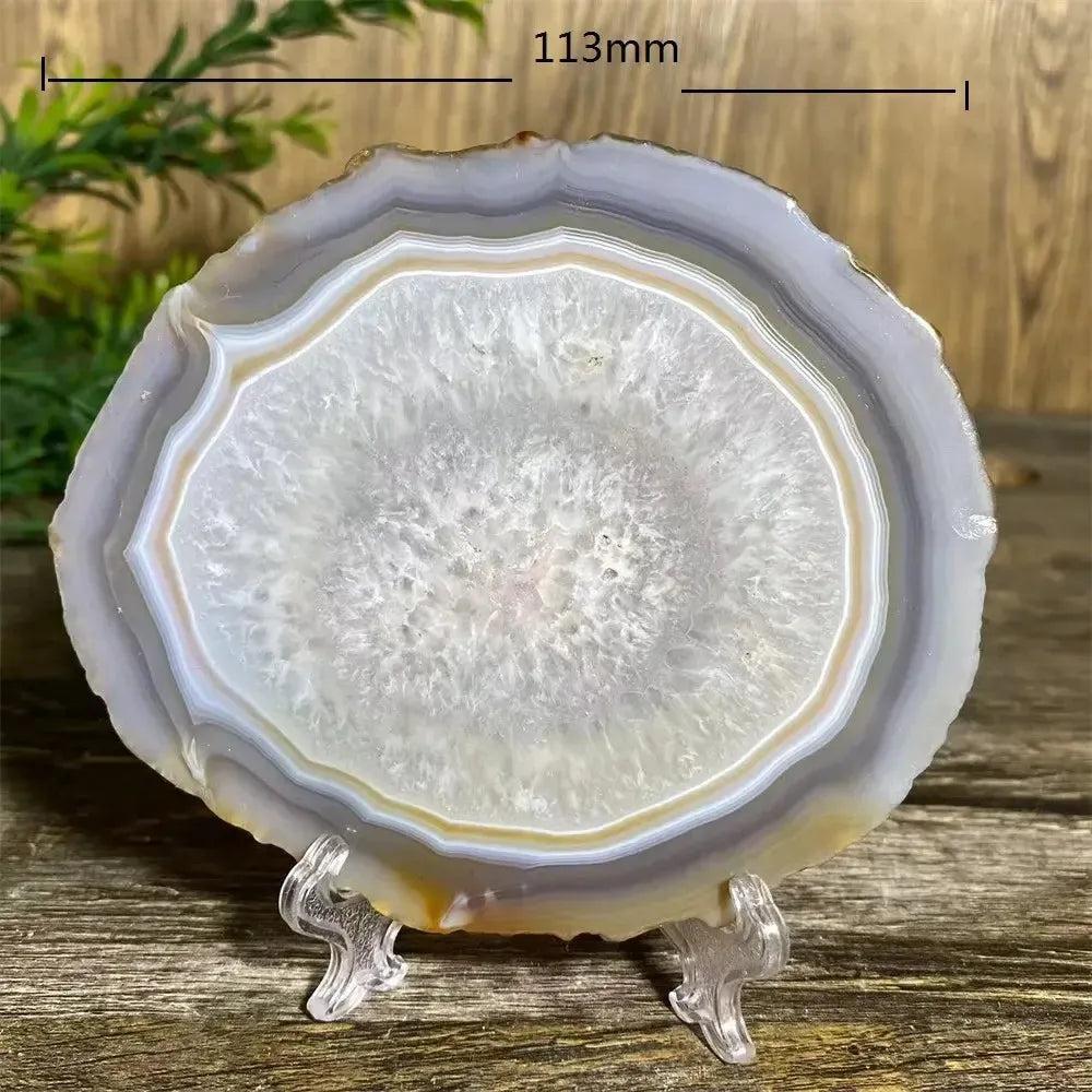 Agate Slice with Stand: Polished, banded natural agate in white, gray, and amber, promoting calm and balance.