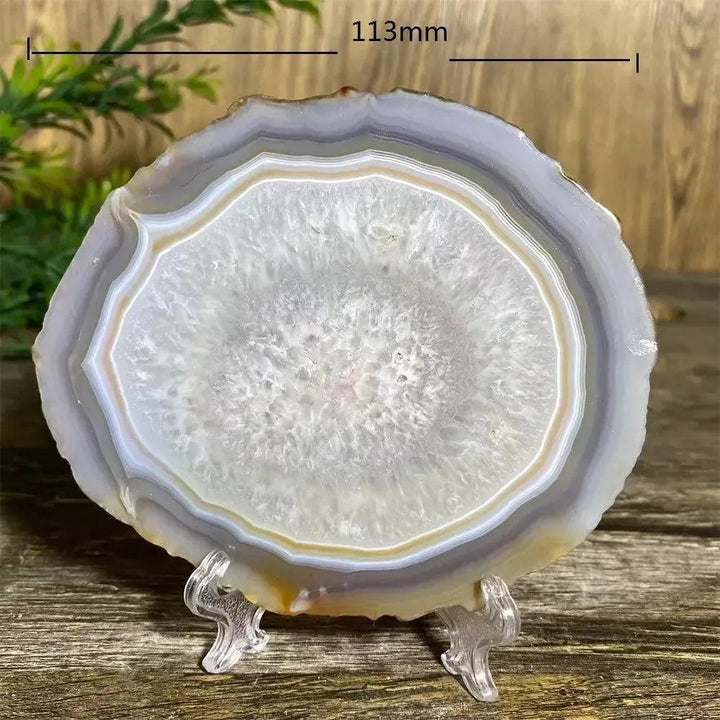 Agate Slice with Stand: Polished, banded natural agate in white, gray, and amber, promoting calm and balance.