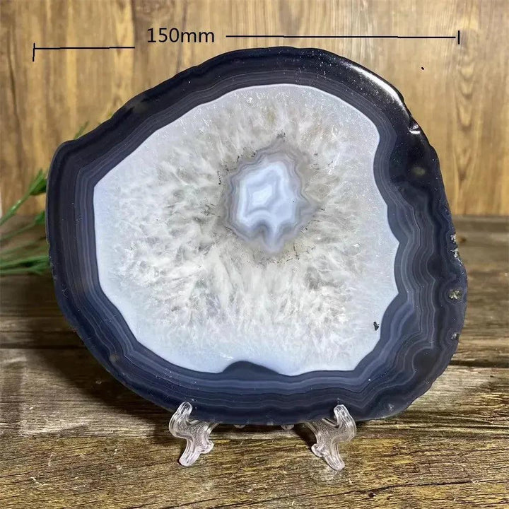 Stunning 150mm Agate Slice with Stand, showcasing grounding black, white, and gray bands for balanced energy.