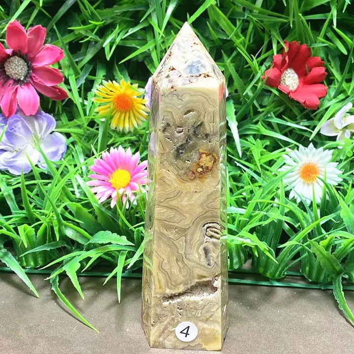 Polished Agate crystal tower with unique earthy banding, perfect for grounding and stability in any crystal collection.