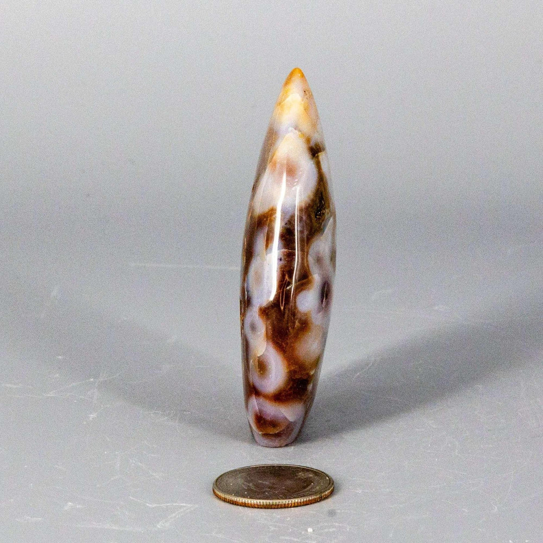 Agate Torch Freeform: Tapered, polished stone with warm, earthy tones and unique banding, ideal for meditation or display.