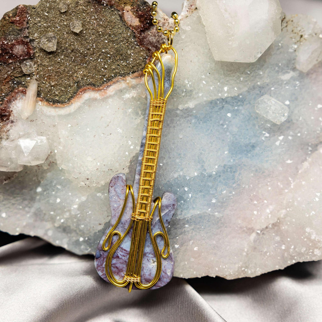 Handcrafted Agate Guitar Wire Wrap Pendant, 3.75-inch, with copper wire and unique banded agate for stability and creativity.