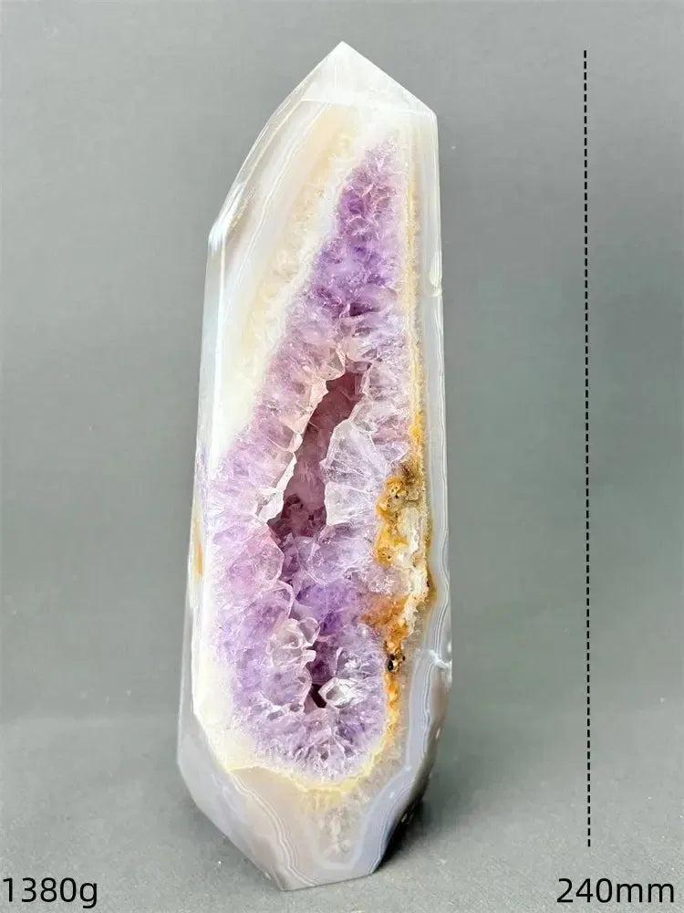 Polished Agate geode tower with a sparkling purple amethyst druzy cave and earthy banded exterior.