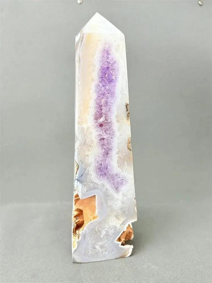 Polished Agate geode crystal tower with a sparkling purple druzy cavity and earthy brown, cream, and gold banding.