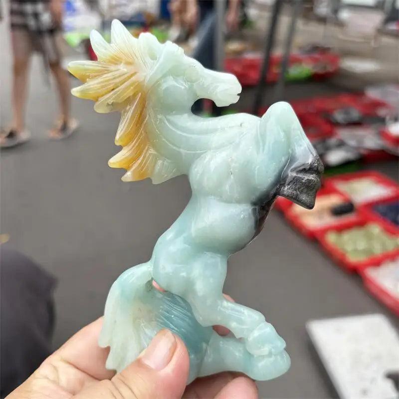 Hand-carved Amazonite horse sculpture with a polished seafoam finish, perfect for calming heart and throat chakra energy.