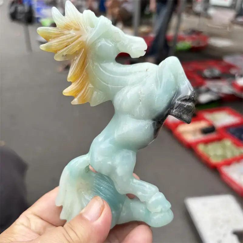 Hand-carved Amazonite horse statue with a polished seafoam finish, promoting calming heart and throat chakra energy.