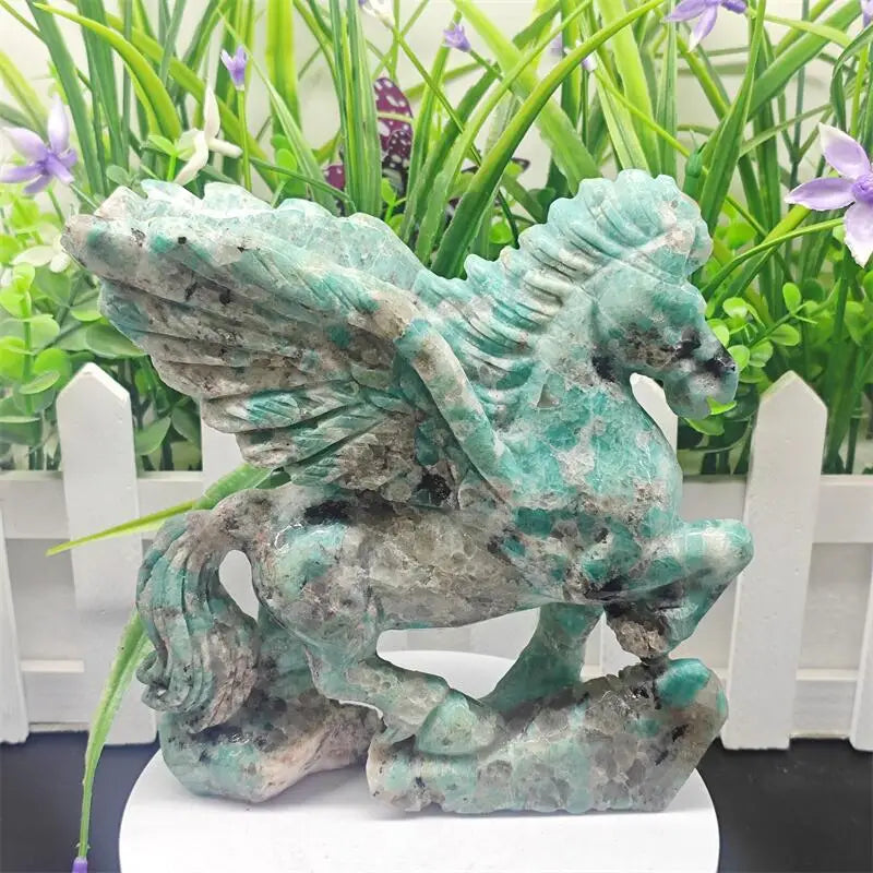 Large Amazonite crystal unicorn sculpture featuring vivid teal-green hues and calming Heart Chakra energy.