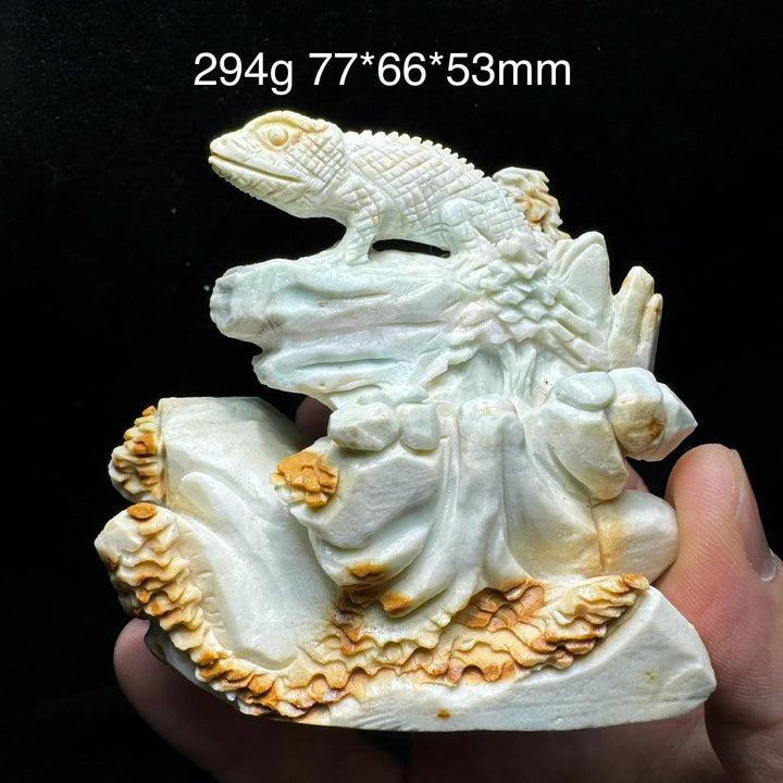 Hand-carved amazonite lizard figurine, unpolished, with natural teal, seafoam, and cream swirls, promoting calm.
