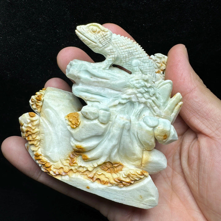 Hand-carved amazonite lizard figurine, unpolished, with teal, seafoam, and cream swirls, promoting peace and calm.