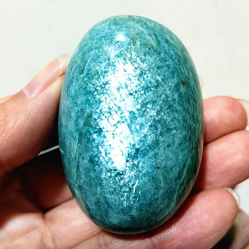 Polished Amazonite Crystal Palm Stone: calming teal and cream, smooth, grounding energy, perfect for peace and tranquility.