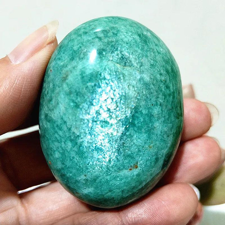 Polished Amazonite Crystal Palm Stone, a calming teal and cream natural specimen for peace and clear communication.