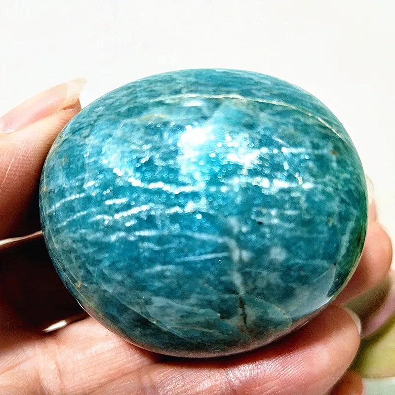 Polished Amazonite Crystal Sphere, a natural specimen with calming teal and cream tones for peace and clarity.