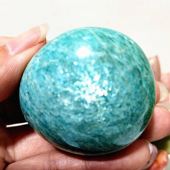 Hand-polished Amazonite Crystal Polished Palm Stone, a calming teal and cream natural specimen for peace and clarity.