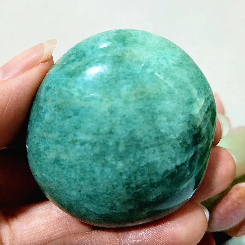 Amazonite Crystal Polished Palm Stone: Smooth, calming teal and cream stone for peace and clear communication.