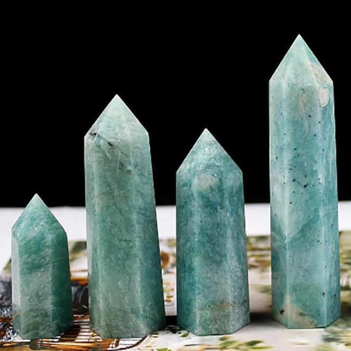 Four polished green Amazonite crystal towers in varying sizes, perfect for aesthetic home decor and healing.