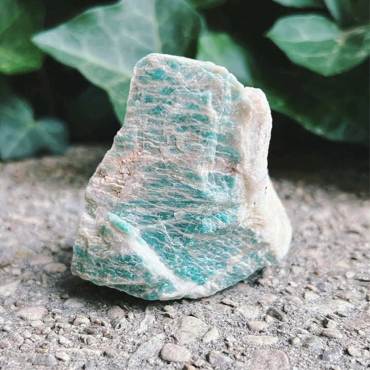 Raw Amazonite crystal with natural blue-green texture and rough, unpolished edges for grounding and heart chakra healing.