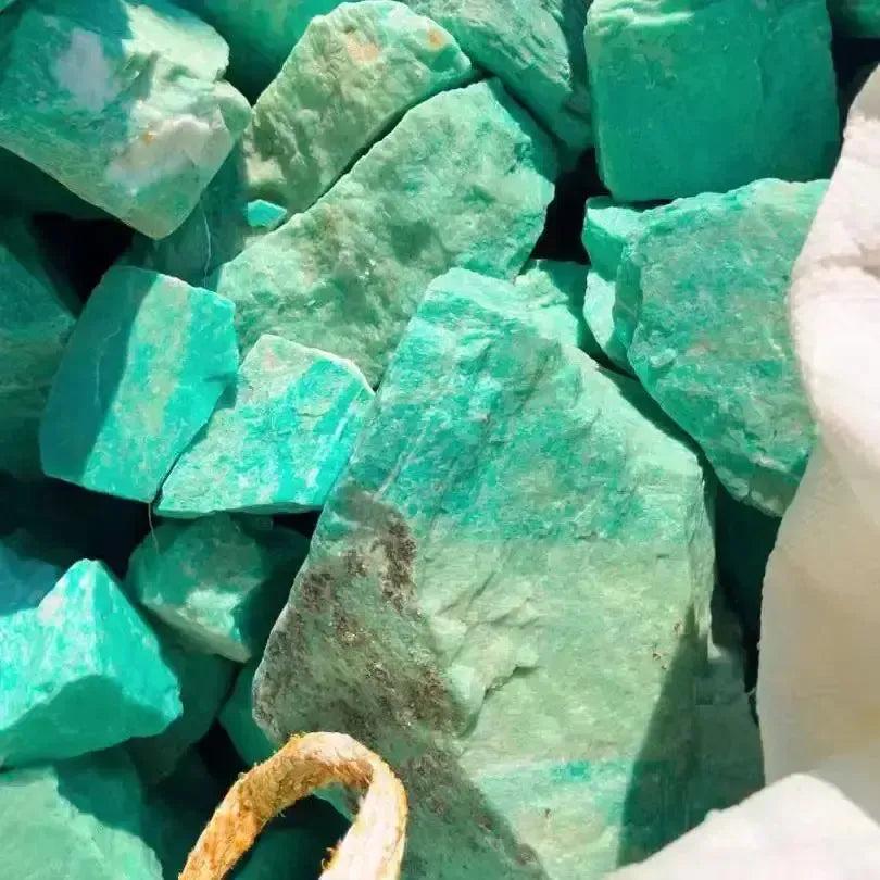 Raw Amazonite crystals from Crystal Destiny, featuring vibrant turquoise-green hues and natural textures for calming energy.
