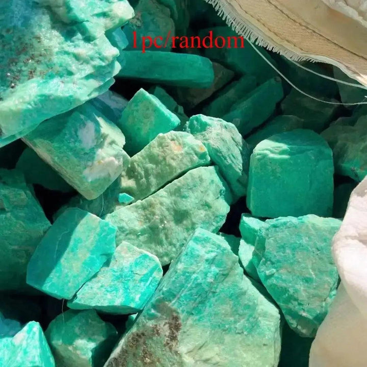 Raw Amazonite crystals in varying turquoise-green hues, perfect for calming anxiety and enhancing communication.