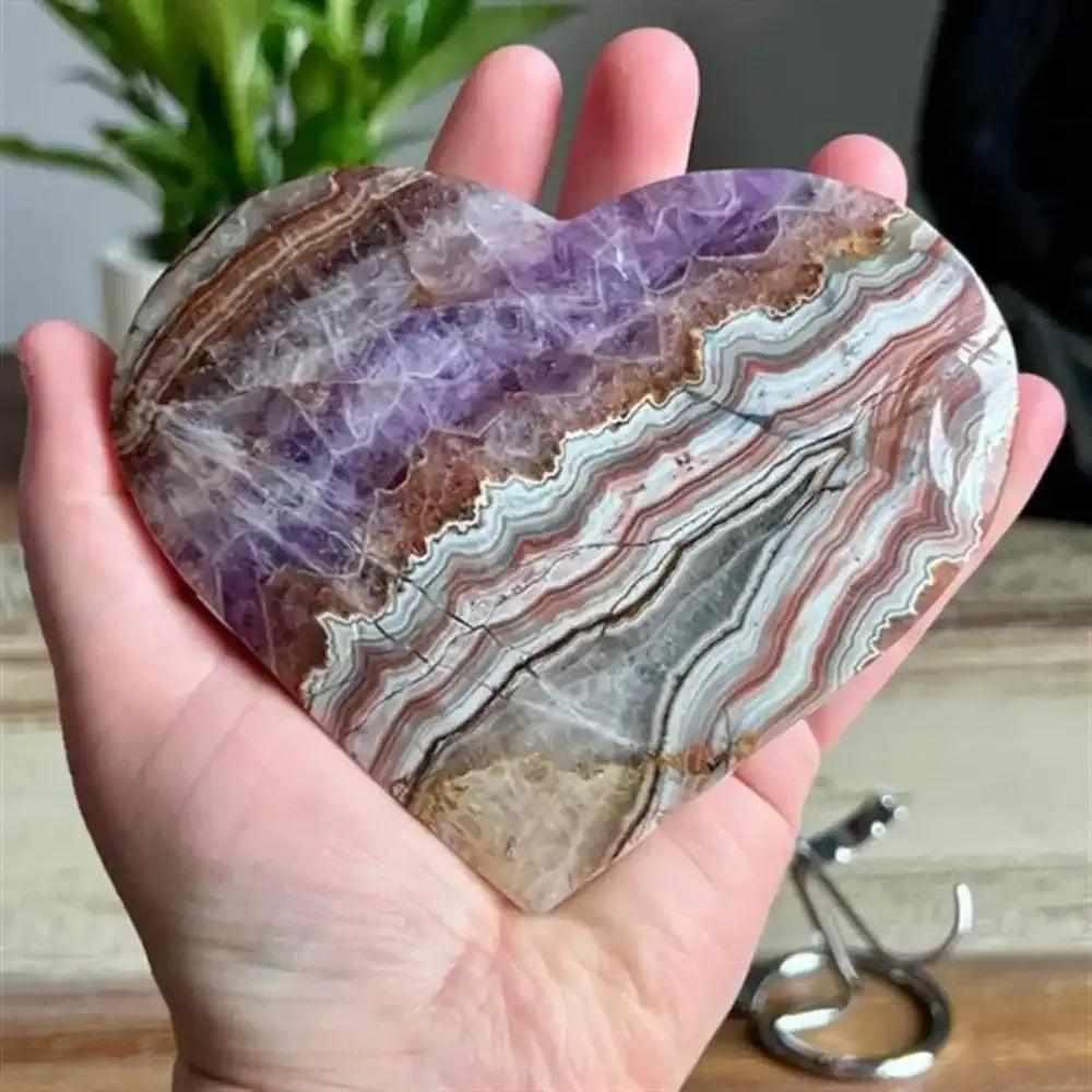 Polished amethyst agate heart sculpture featuring natural purple and banded brown layers, perfect for romantic home decor.