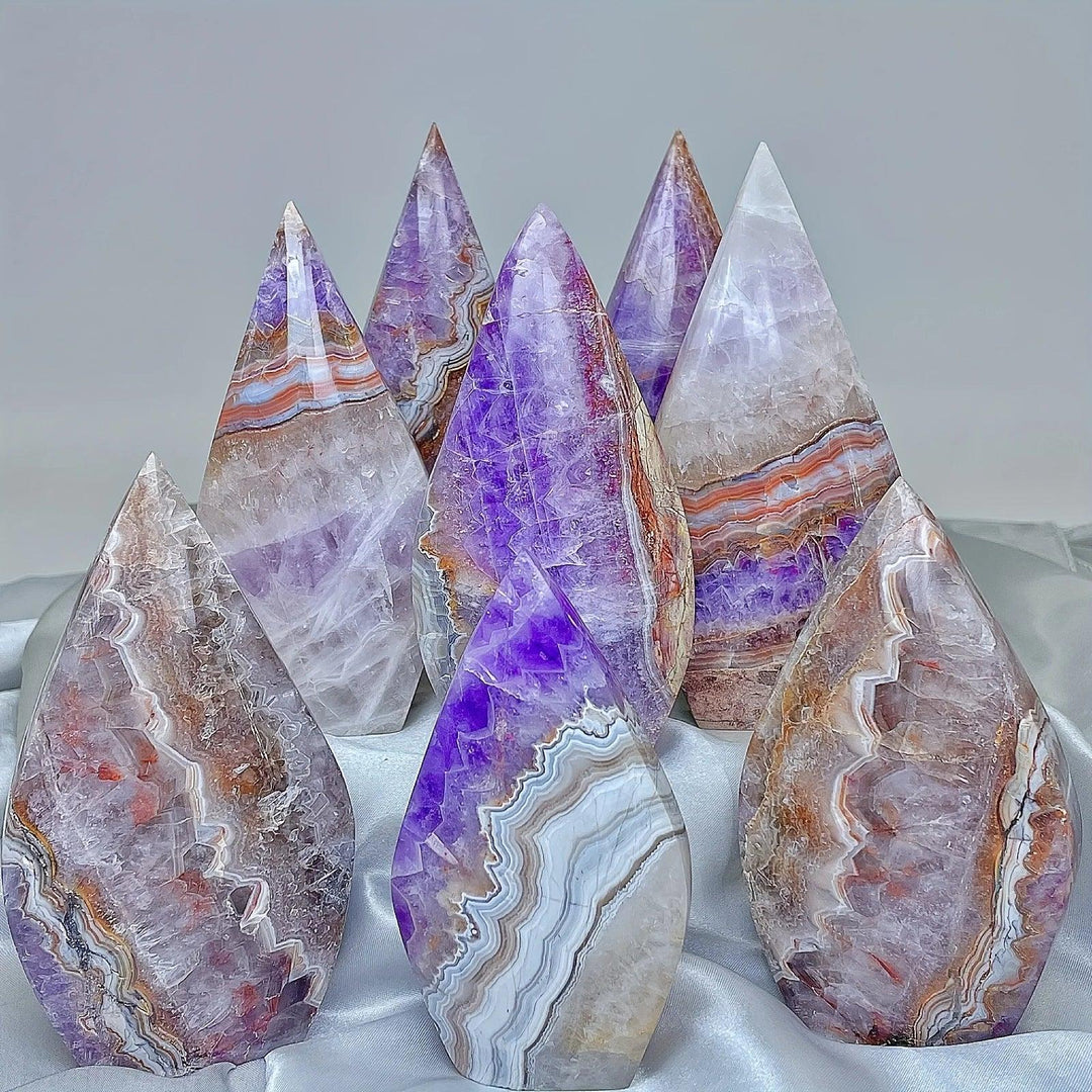 Banded Amethyst Agate crystal torch freeforms in various sizes, displaying violet, white, and earthy layers.