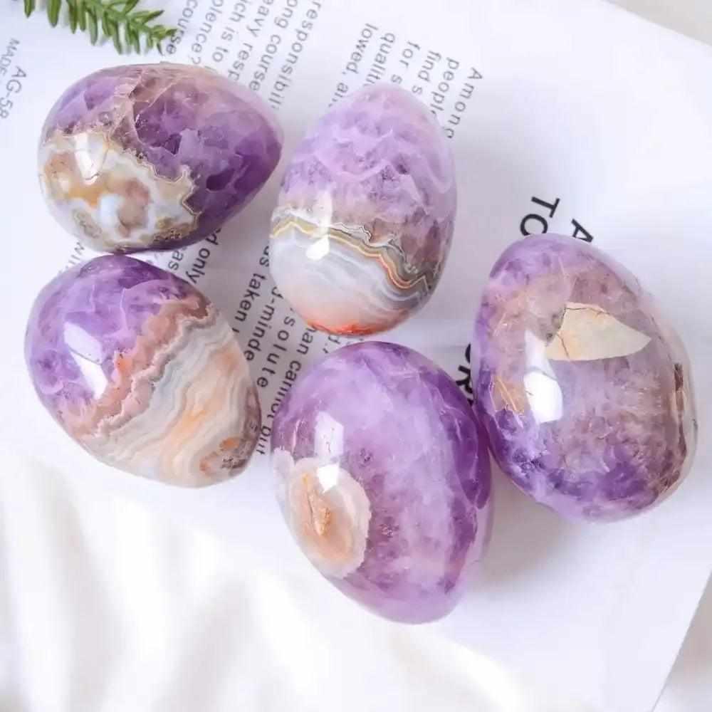 AAAA+ Amethyst Agate eggs with purple hues and banded white, gray, and brown patterns for peaceful meditation.