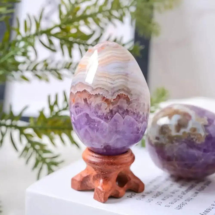 AAAA+ Amethyst Agate egg with purple crystals and white banded agate, hand-polished for meditation and chakra healing.