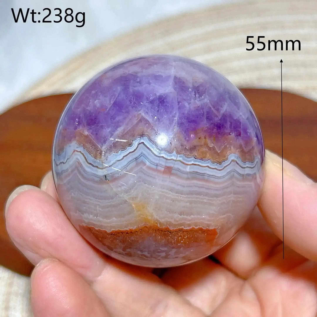 Hand-polished Amethyst Agate sphere featuring purple amethyst and banded gray, white, and brown patterns for peaceful focus.
