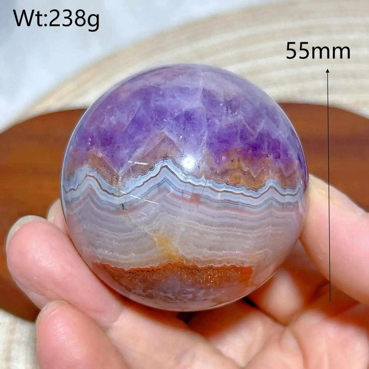 Hand-polished Amethyst Agate sphere featuring purple amethyst and banded gray, white, and brown patterns for peaceful focus.