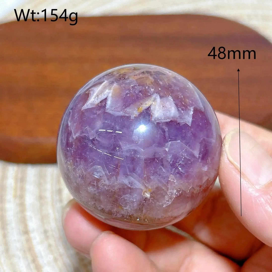 Hand-polished Amethyst Agate sphere with purple hues and banded patterns for peaceful meditation and chakra balancing.