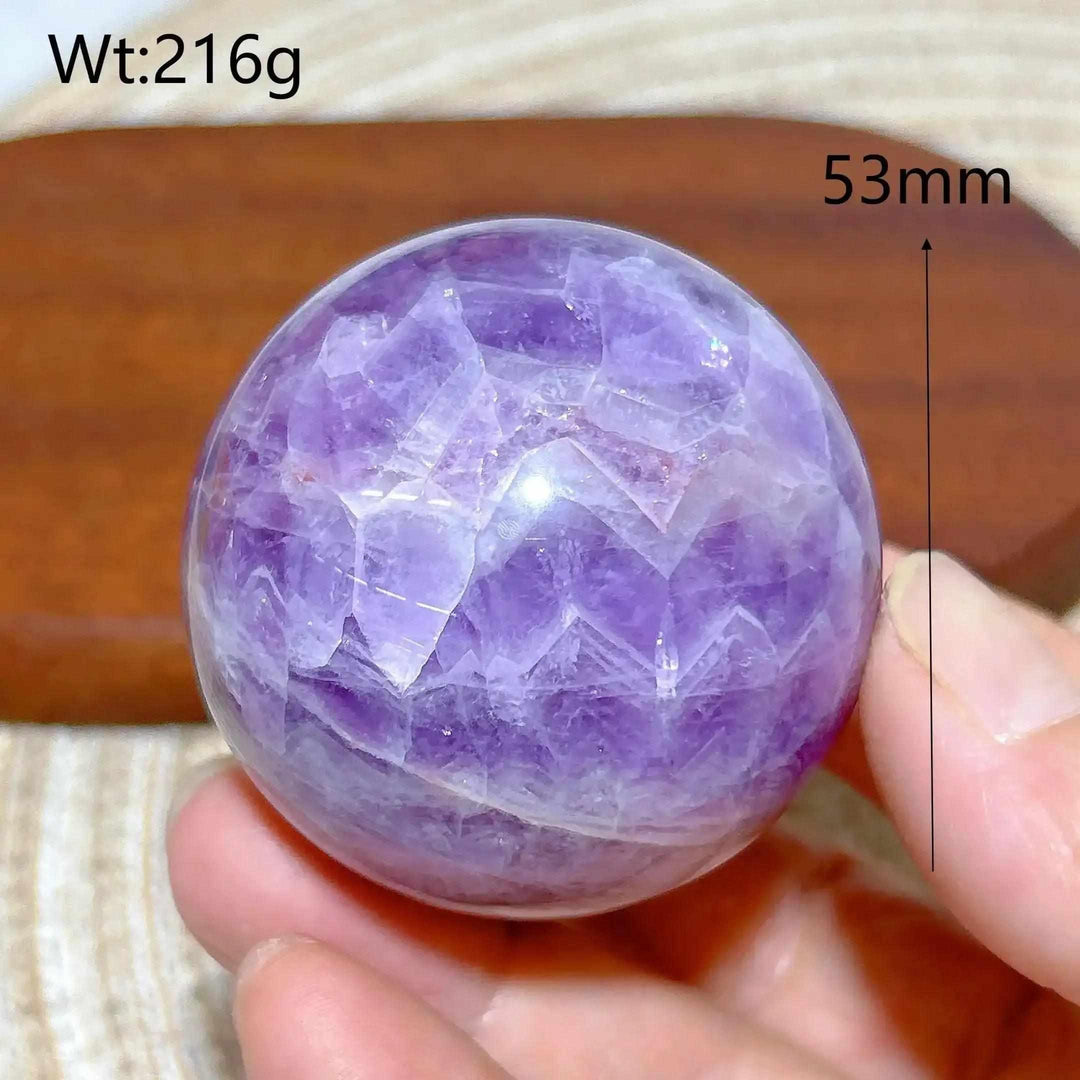Hand-polished 53mm Amethyst Agate sphere with vibrant purple hues for peaceful focus and Crown Chakra meditation.
