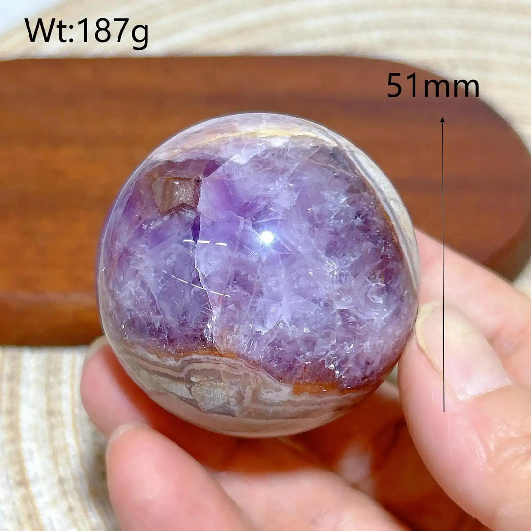 Hand-polished Amethyst Agate sphere featuring purple amethyst and banded white, gray, and brown patterns for peaceful focus.