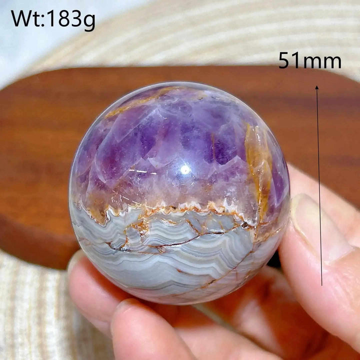 Hand-polished Amethyst Agate sphere featuring purple amethyst and banded gray agate for peaceful meditation and focus.