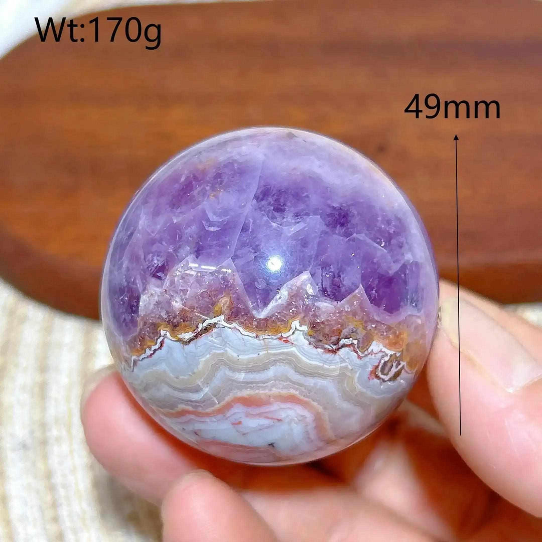 Hand-polished Amethyst Agate sphere featuring purple amethyst and banded white, gray, and brown patterns for meditation.