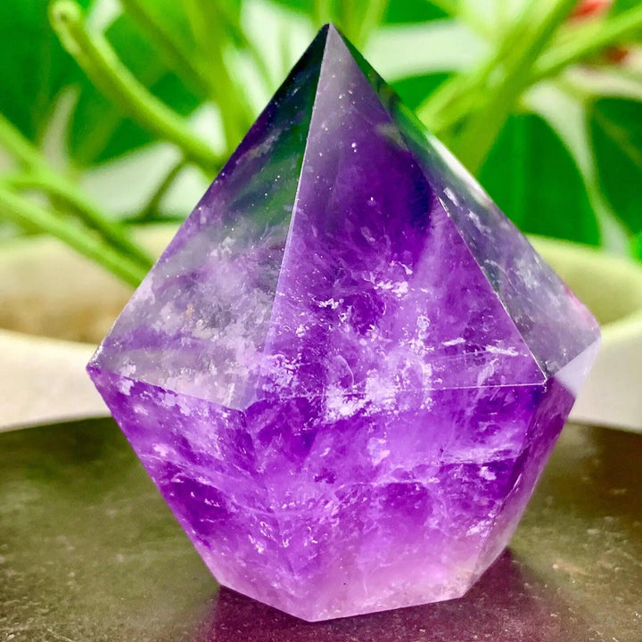 Natural purple crystal tower energy healing wand, a stunning FENG SHUI MASCOT for spiritual well-being.