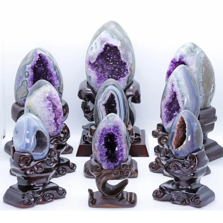 Amethyst Crystal Natural Geode Statement Piece with deep violet crystals on a wooden stand for peace and tranquility.