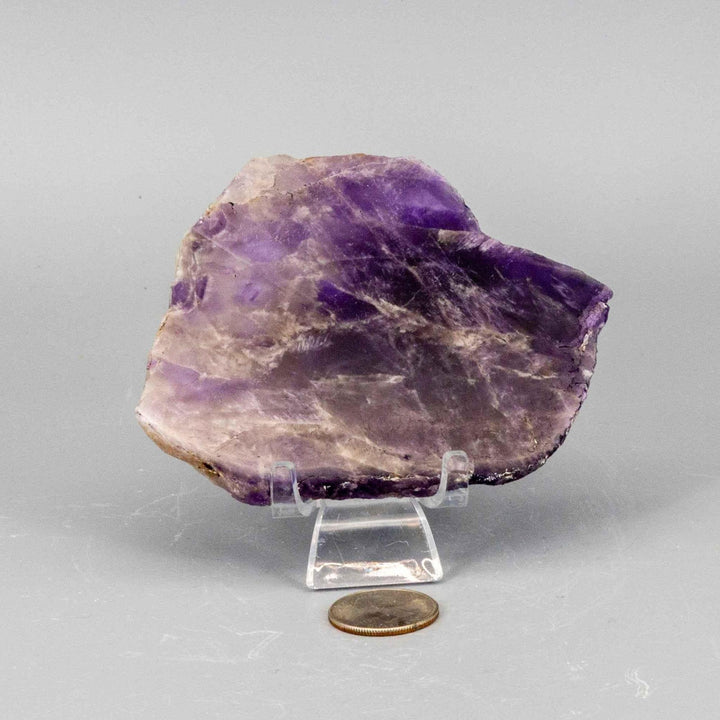 Polished Amethyst Slice: deep violet to lavender crystal with natural edges, revealing internal crystalline structure.