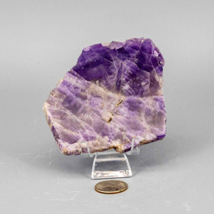 Polished Amethyst Slice, a deep violet to lavender crystal with natural edges, revealing its internal structure.