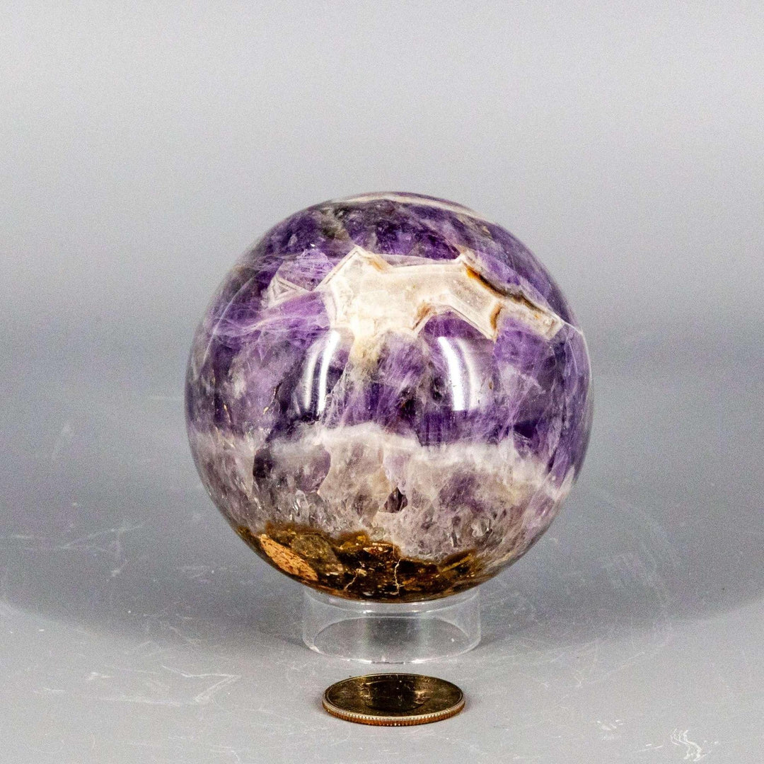 Stunning Amethyst Sphere, 45-72mm, showcasing deep purple hues, natural crystal formations, and a polished finish for calm and clarity.