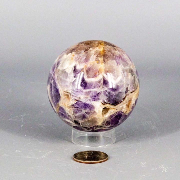 Stunning Amethyst Sphere, 45-72mm, with deep purple, lavender, and white radiating from its polished surface.