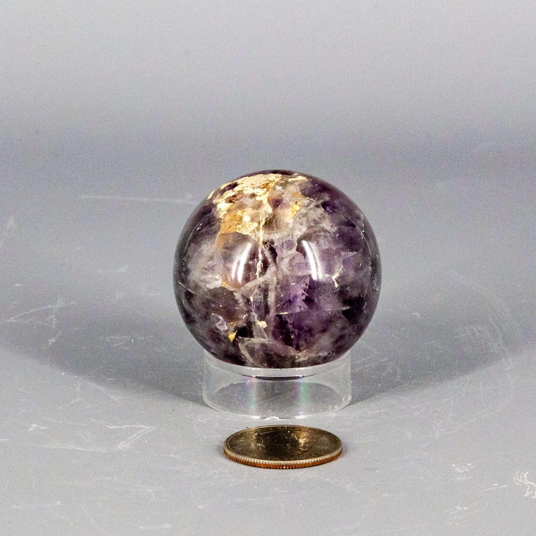Stunning Amethyst Sphere, 45-72mm, showcasing deep purple hues, natural crystal formations, and polished finish for calm and clarity.